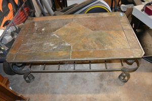 lot 133 image: Patio or coffee table. Solid metal base with tile top (needs a little attention)