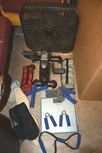 lot 142 image: Exercise lot Seated pedal machine, box fan, scales, small weights and ankle weights, belts, jump rope and more