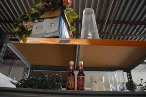 lot 145 image: Artificial flowers, large clear vase, Christmas lights, collector Dr. Pepper bottles and more