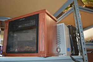lot 157 image: Personal space heaters and Oreck air purifier
