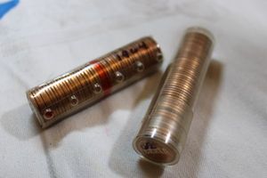 lot 180 image: 2 rolls of uncirculated pennies - 1 1962, 1 1964 - 95% copper
