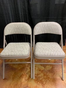 lot 137 image: Two Folding padded chairs as shown see pics.