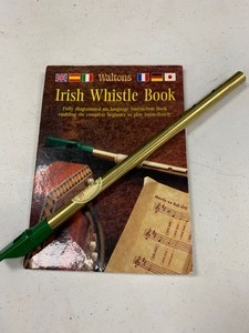 lot 132 image: Irish Whistle and book SWEET
