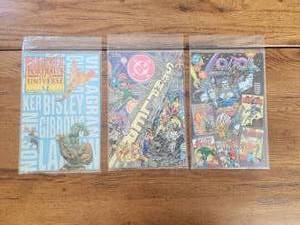 lot 82 image: Selection of Comics - Marvel Portraits of A Universe, DC Sampler comic, DC Convention special