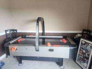 lot 1 image: SportCraft turbo air hockey table - one of the game paddle holders needs to be glued together - Game has been dismantled for easy moving