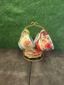 lot 163 image: Pioneer Woman coffee mug and saucer set with display rage - yellow cup has chip