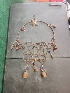lot 18 image: Metal wind chime - cow themed