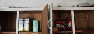 lot 191 image: Battery charger, Perfect Seal, Snake-It - top shelf of cabinet