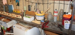 lot 186 image: Vise clamp plus tools and hardware on garage counter