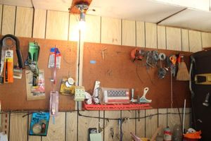 lot 185 image: Peg boards with tools and contents