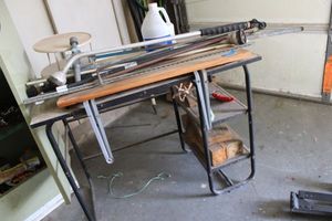 lot 173 image: Student desk with extension yard sprayers and contents