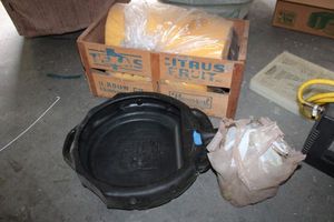 lot 172 image: Wooden Fruit crate, foam pad, Plastic oil pan, Motor oil and engine oil cans