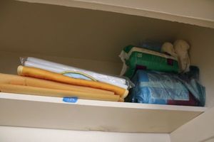 lot 134 image: mattress pads and Depends as shown