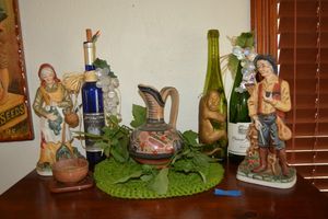 lot 18 image: Home dcor with porcelain man and woman figurines and wine bottles