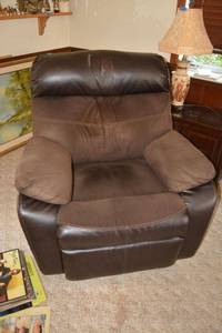 lot 34 image: Brown leather oversized recliner by Ashley furniture