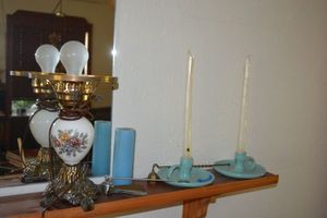 lot 42 image: Pair of artisan pottery candle holders, candle snuffers and porcelain table lamp as shown