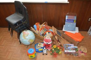 lot 51 image: Kids lot stackable chairs, toys, puzzles, plastic tablecloths, and globe