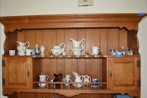 lot 58 image: Knick Knacks - Delft porcelain clogs, miniature bells and antique stove, animal ceramic creamers and more