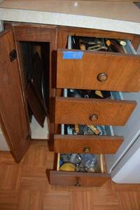 lot 77 image: Kitchen cookie sheets, knives and utensils. Includes vintage bone saw.