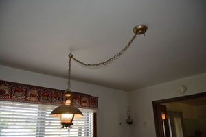 lot 82 image: Vintage hanging hurricane lamp, bring tools to remove
