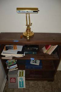 lot 101 image: Books and desk lamp - Bibles, books about Bible, First Aid Books and Medical Encyclopedias