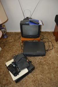 lot 105 image: Electronics VCR players, Admiral 13 color TV, and antenna