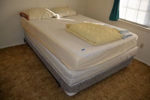 lot 107 image: QueenFull size bed and frame, includes memory foam mattress and down pillows
