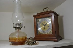 lot 5 image: Sligh Mantel clock model 0522-1-CM and oil lamp as shown