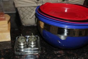 lot 71 image: Assorted Colour Metal Mixing bowls with Lids and Pewter Salt and Pepper Elephant shakers