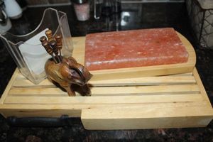 lot 72 image: Wooden Bread Cutting Board with Knife, Salt Rock with wooden Tray, Bagel Slicer and Elephant with cocktail forks