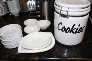 lot 74 image: White cookies canister, and a variety of white dishes