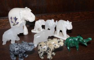 lot 21 image: Variety of Elephants, Hand Carved,  Including Soap stone, and Malachite Stone from Central Africa for Good Luck and Healing