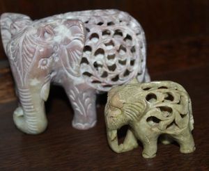 lot 19 image: Soap Stone Elephants with Babies inside