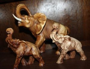 lot 23 image: Collection  of Three hand carved wooden elephants of different sizes