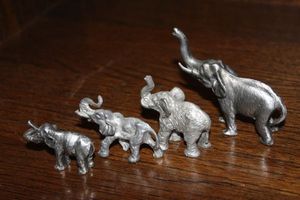 lot 25 image: Four Pewter Elephants