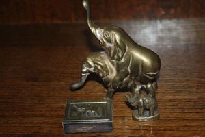 lot 26 image: Friendly Brass Elephants and Match box Case