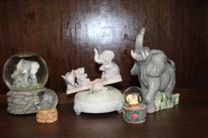 lot 39 image: Elephant Snow Globes, Musical Teeter Toter and more