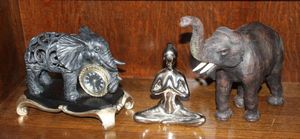 lot 54 image: &nbspBombay &amp Company Elephant Clock Black and Gold, Vintage Leather in cased elephant (see photos) and 1 of the set of 2 Torre and Tagus Silver Chrome Yoga