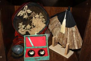 lot 60 image: Chinese Home Decor Including A Thin Leather Fan, and an Chinese Cork Diorama and 1 Pair of Chinese Baoding Balls with YinYang Symbols, Chiming Balls