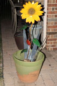 lot 125 image: Terra Cotta Planter with Metal Flower