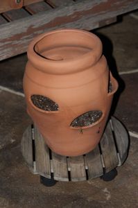 lot 134 image: Terracotta Pot on roller