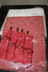 lot 107 image: Unused Place Setting Set ..includes White Table Cloth, Place mats and Chopsticks for 4.