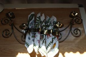 lot 239 image: Candle holders and napkins with brass rings
