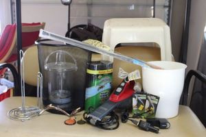 lot 257 image: Variety Lot trash cans, vacuum, wasp spray, tension rod and more