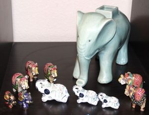 lot 174 image: Blue Ceramic Elephant, 3 Small Porcelain Elephants , 5 Hand carved, Hand painted Elephants from India and more