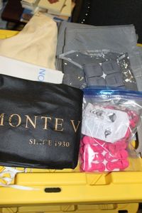 lot 202 image: Variety of Closet Items, Legging Pocketed hanging bags, Hanger clips for pantsskirts, hanger hugs (put two hangers together) and Clothing Bags