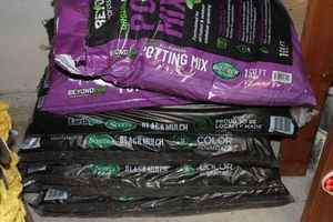 lot 205 image: Unused Bags of Potting Soil and Mulch