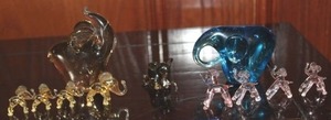lot 272 image: Glass Elephants, Blue paperweight and Four Mini Pink Elephants, Amber Coloured Paperweight and Four Amber Coloured Mini Elephants and 1 unique Mini Elephant