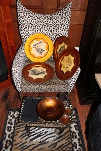 lot 276 image: Animal Print Rug, Stool Plastic tray and Decorative Charger plates, and Chair