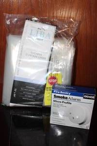lot 327 image: Unused Shower Liner and Smoke Alarm